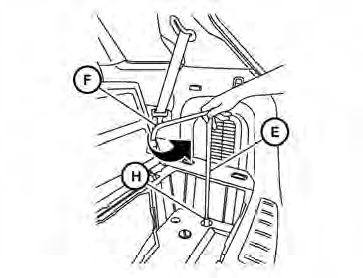 6. Insert the spare tire winch socket H to the